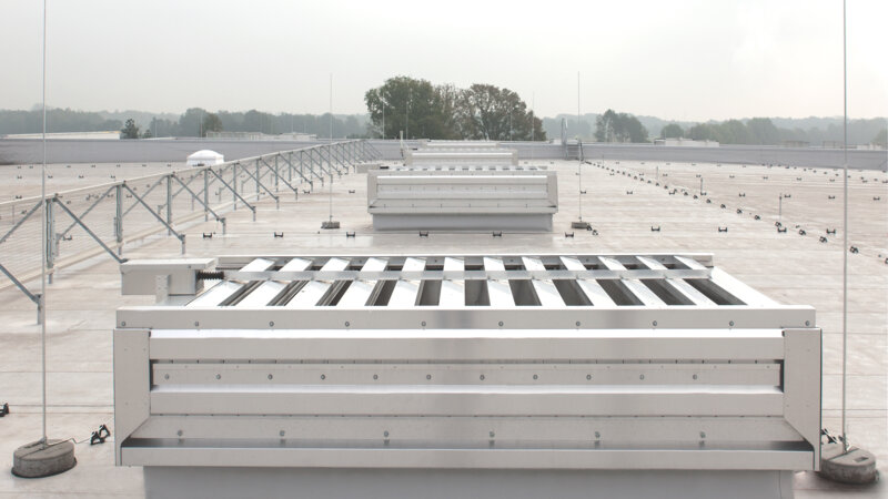 Schumacher-Gruppe | Greven • Hydra labyrinth ventilator and Lyra louvered ventilator with sound traps. Also with 255 m2 continuous rooflight and smoke and heat exhaust devices
